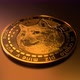Golden bitcoin slowly rotating on goldish floor - VideoHive Item for Sale