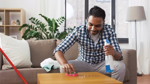 Indian Man Cleaning Table with Detergent at Home 33