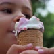 A child enjoying ice cream on a hot summer day. Melted ice cream in the hands of a child. - VideoHive Item for Sale