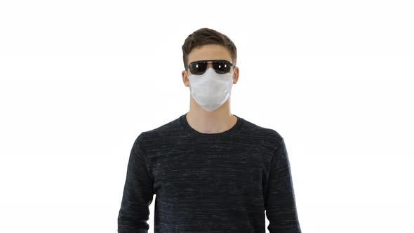 Blind Man in Face Mask and in Dark Glasses with Walking on White Background