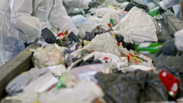 Workers Separating Plastic from Household Waste