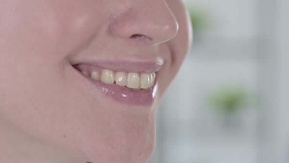 Close Up of Young Woman Smiling with Healthy Teeth