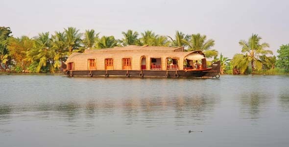 House Boat Moored Alongside Canal In Kerala