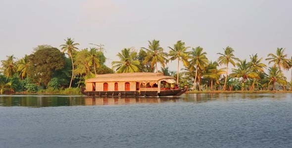 House Boat Moored Alongside Canal In Kerala