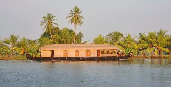 House Boat Moored Alongside Canal In Kerala