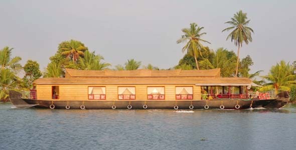 House Boat Moored Alongside Canal In Kerala