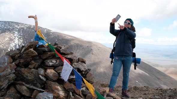 Woman Hiker Taking Selfie on the Top of Mountain