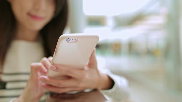 Woman using cellphone for browsing online 