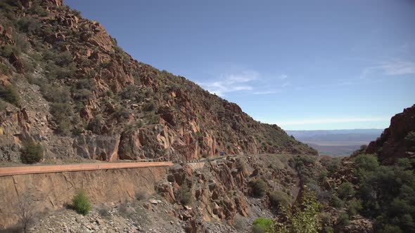 Pan right of hills and a road