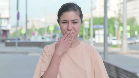 Portrait of Indian Woman Giving Flying Kiss By Hands