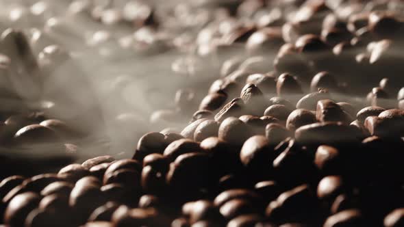 Rotating Roasted Coffee Machine with Smoke Coming Out From Beans