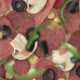 Various kind of toppings rain on a pizza dough in slow motion - VideoHive Item for Sale