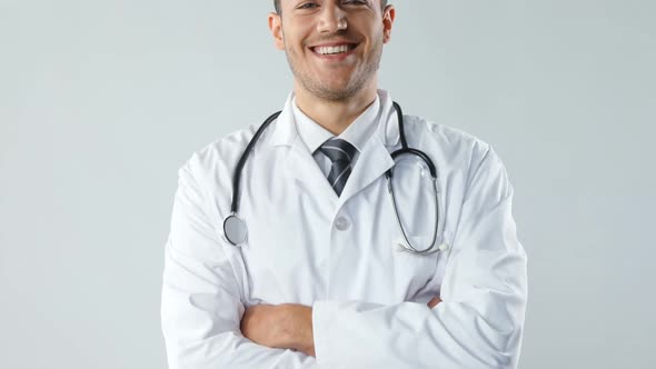 Smiling doctor standing with his hands crossed 4K 4k