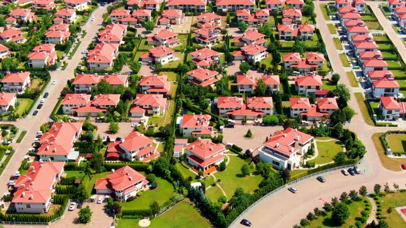 Street with new homes in spring season. Single family houses and residential construction planned co