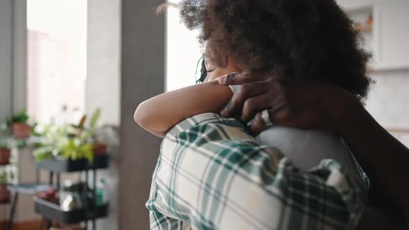 Excited African American Girl Running to Her Father After Separation Embracing Him Hard and Smiling