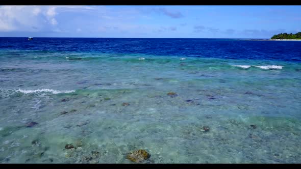 Aerial panorama of perfect tourist beach lifestyle by shallow water and white sand background of a p