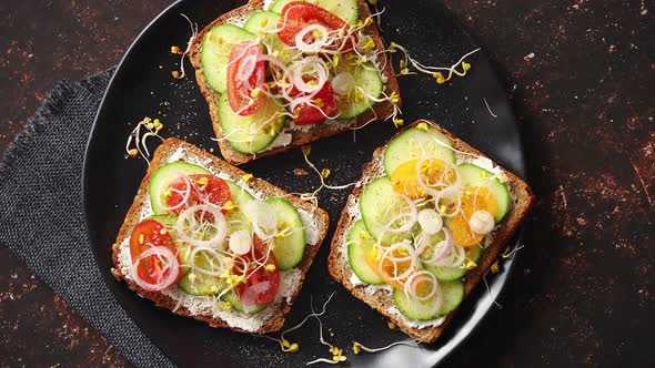 Healthy Toasts with Cucomber, Tomatoes and Crumbled Feta and Radish Sprouts