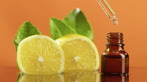 Dripping Lemon Juice From Pipette Into Bottle Closeup Vitamin Oil