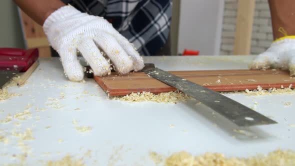 Carpenter Working on Wood Craft at Workshop