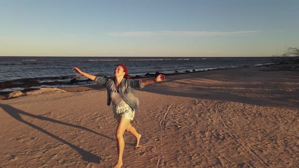 Dolly Out: Very Happy LGBT Woman Wears Rainbow Bracelet and Runs at Camera, Jumps at Man