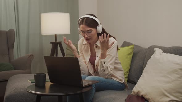 A European Woman Talks on a Video Link on a Computer