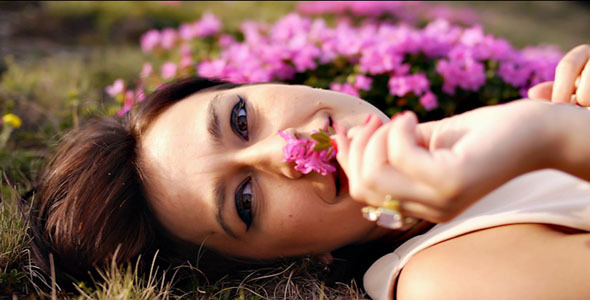 Girl Smelling Fresh Flowers