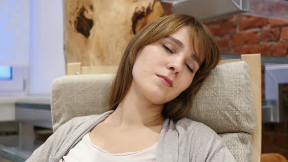 Sleeping Tired Young Woman Sitting in Office