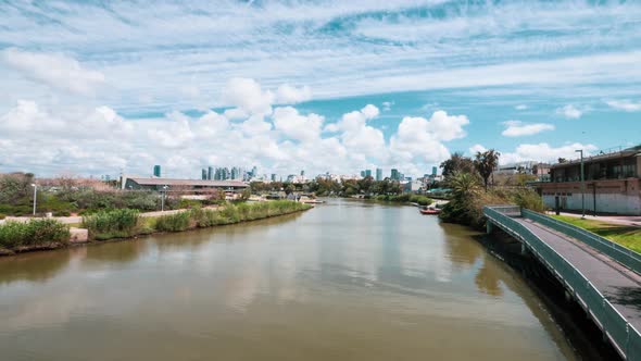 Beautiful Summer day puffy clouds over the Yarkon river in Tel aviv
