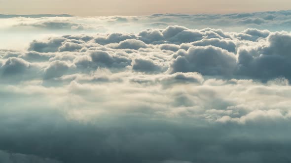 timelapse foggy or over the clouds while sunrise sky.
