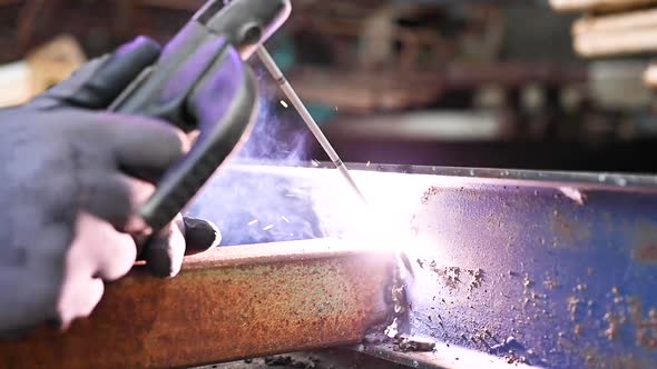 Close-up of the Welding Process of Two Metal Parts in Slow Motion.