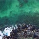 The waves of the ocean break on the rocky shore. Transparent clean water and the seabed near the sho - VideoHive Item for Sale