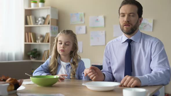 Pretty Girl and Her Father Praying Before Eating Breakfast, Spiritual Education