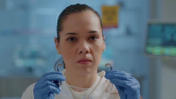 Scientist Putting Safety Glasses on for Protection