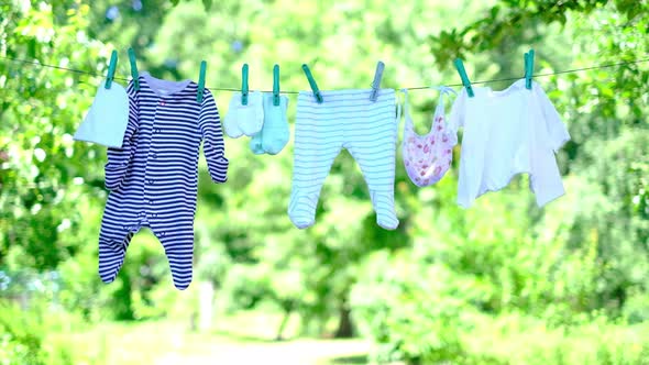 Baby Clothes on Clothesline in Garden