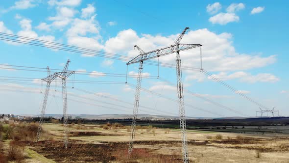 Aerial View Long-distance Power Transmission Lines. High-voltage Poles That Efficiently Transmit