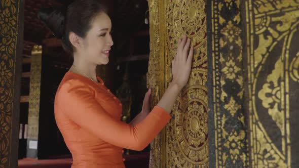 Beautiful Asian Girl Stroking Door's Temple