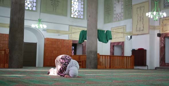 Muslim Girl Saying Salat Prayer In Mosque