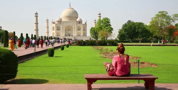 Woman Sitting And Looking To Taj Mahal
