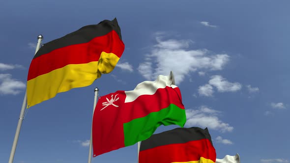 Flags of Oman and Germany at International Meeting