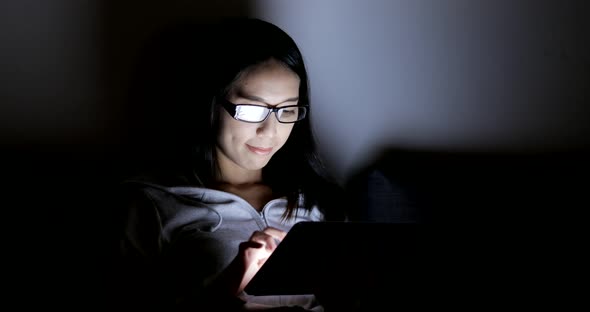 Woman Using Digital Tablet Computer at Home