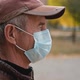 Close Up Portrait of Senior Man Wearing Protective Medical Face Mask - VideoHive Item for Sale
