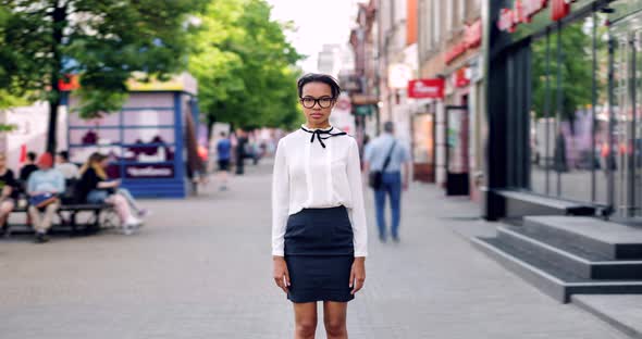 Zoom in Time Lapse of Pretty African American Lady in Busy Street on Summer Day