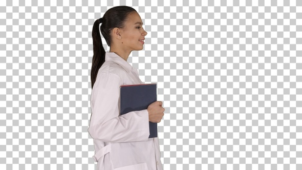 Happy smiling female doctor walking holding notebooks or