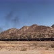 Freight Train Rides on Railroad in Desert - VideoHive Item for Sale