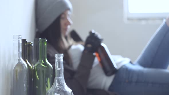 Young Homeless Drunk Woman Adult. Alcohol Addiction Concept