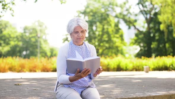 Senior Woman Reading Book at Summer Park 17