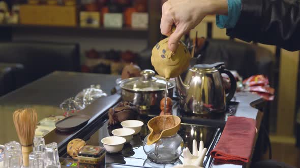 Master Pours Tea Leaves with Water. Tea Ceremony