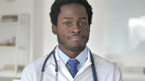 Restricting African Doctor Shaking Head to Reject