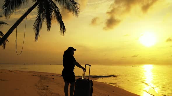 Single lady tanning on beautiful seashore beach wildlife by aqua blue sea and bright sand background