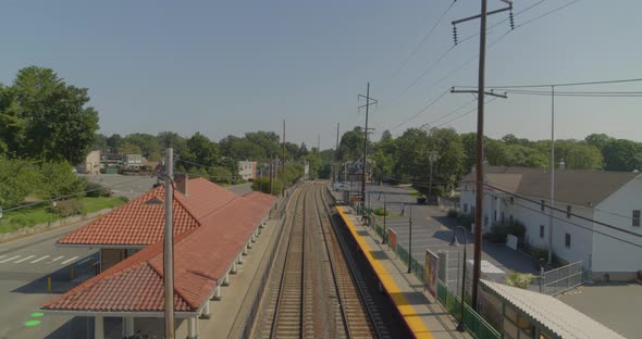 Pedestal Down Shot from Aerial View of Station to Train Tracks